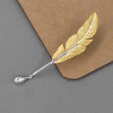 Broche de Pena Banhado a Prata