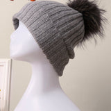 Gorro descaído em caxemira 100% canelada com pompom