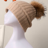 Gorro descaído em caxemira 100% canelada com pompom